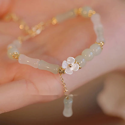 Dainty multi-bead jade-green and mother-of-pearl flower bracelet
